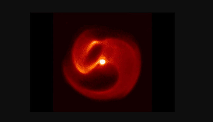 A close up of a red object with a black background